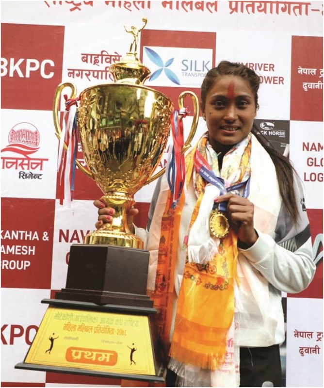 Saraswoti Chaudhary of Nepal APF Club poses with the trophy after the Bhotekoshi Rural Municipality President Cup National Women’s Volleyball Tournament in Sindhupalchok on Saturday. Photo: THT