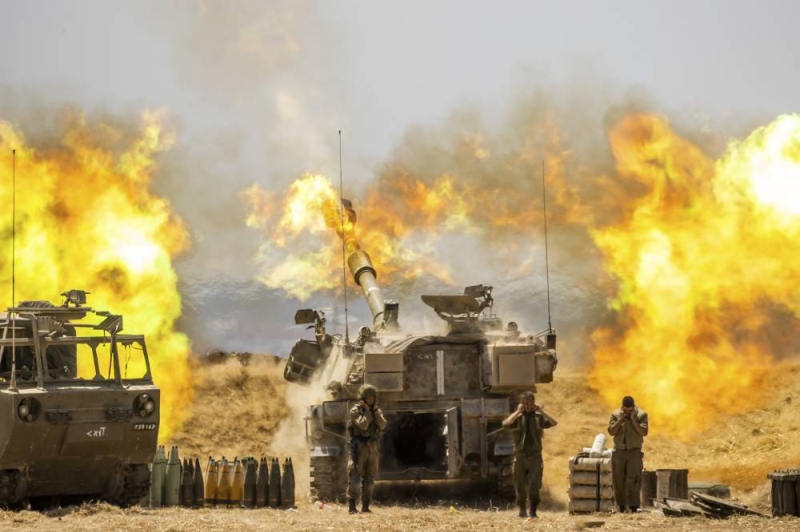 An Israeli artillery unit fires toward targets in Gaza Strip, at the Israeli Gaza border, Wednesday, May 12, 2021. Photo: AP
