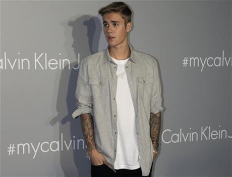 FILE - In this June 11, 2015, file photo, Canadian singer Justin Bieber poses for photographers upon his arrival at a promotional event for Calvin Klein in Hong Kong. Justin Bieber is crediting a Pentecostal pastor with changing his life as he mingles with thousands of Christians at a five-day church conference in Sydney, Australia. AP