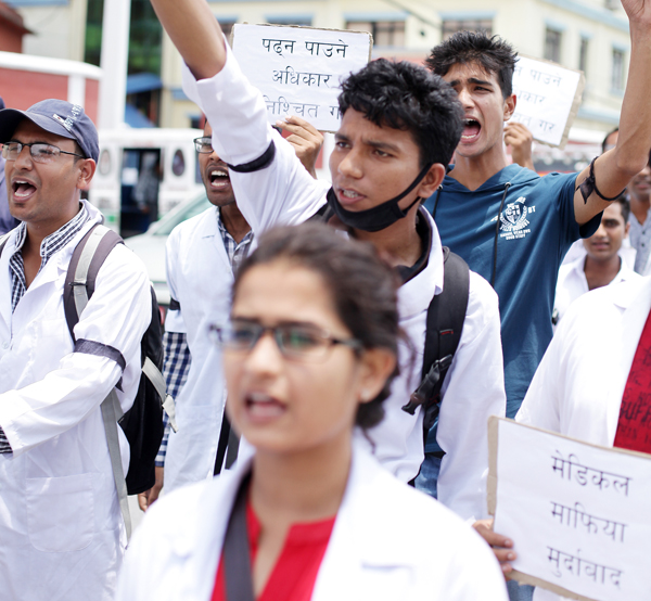 Students of Janaki Medical College, which has remained closed for the past nine months, staging a protest, in nMaharajgunj, Kathmandu, on Monday.
