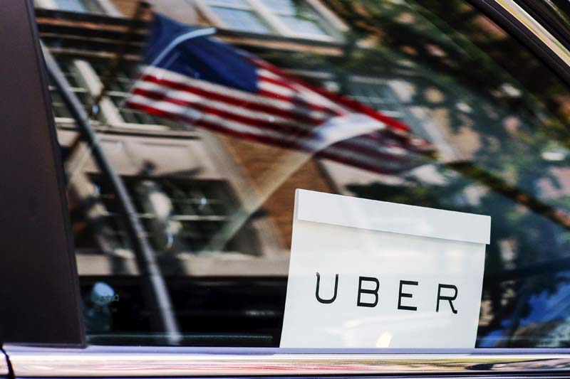 An Uber sign is seen in a car in New York in this photo from June 30, 2015. Photo: Reuters/ File