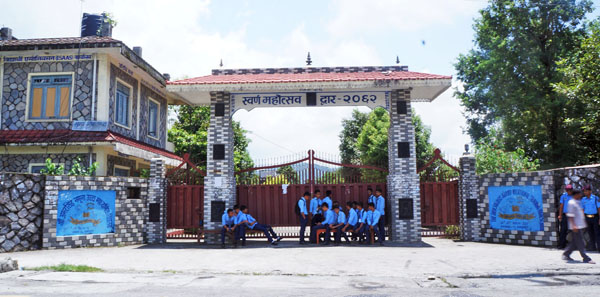 Students padlocking the gate of Amarsingh Namuna Higher Secondary School after their study was halted due to a dispute over the appointment of the head teacher, in Pokhara, on Wednesday. Photo:THT