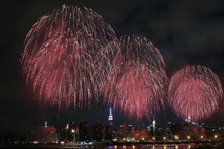 Fireworks explode over the East River in front of the Manhattan skyline as seen from the Brooklyn borough of New York during the Macy's Fourth of July fireworks show Saturday, July 4, 2015. AP