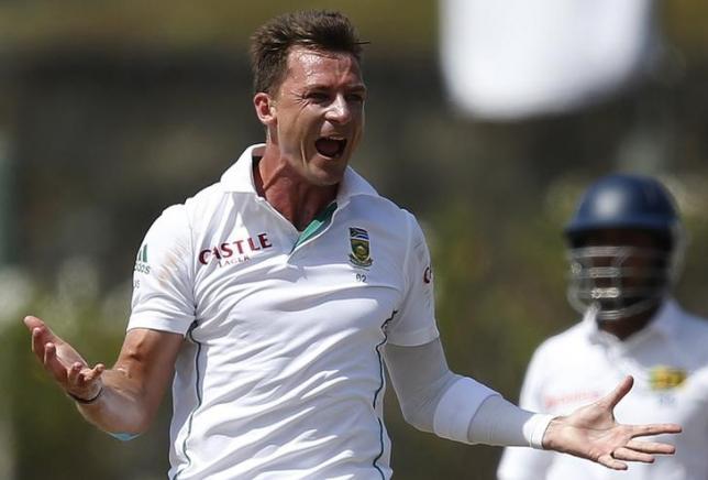 South Africa's Dale Steyn (L) celebrates after taking the wicket of Sri Lanka's Kaushal Silva (not pictured) during the fifth day of their first test cricket match in Galle July 20 2014. REUTERS/Dinuka Liyanawatte