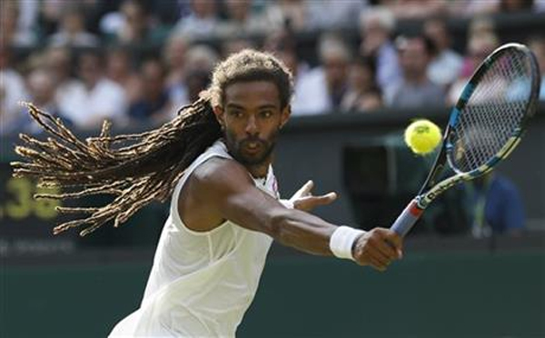 Dustin Brown of Germany returns a ball to Rafael Nadal of Spain during their singles match at the All England Lawn Tennis Championships in Wimbledon, London, Thursday July 2, 2015.nPhoto: AP