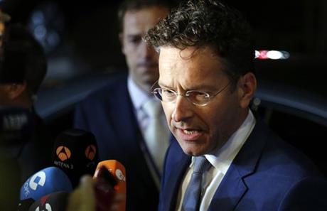 Dutch Finance Minister Jeroen Dijsselbloem speaks with the media as he leaves after a meeting of eurozone finance ministers at the EU Lex building in Brussels on Sunday, July 12, 2015.  AP