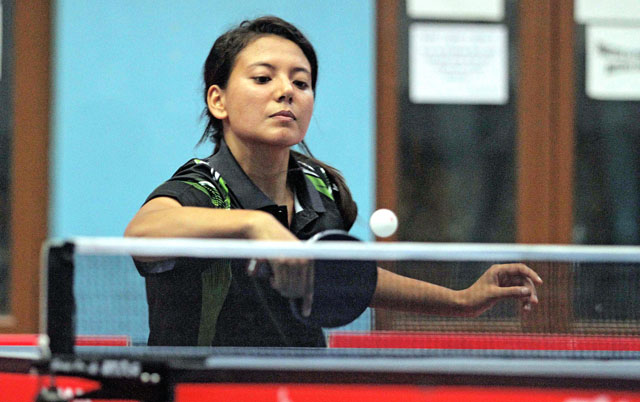 NPC's Elina Maharjan returns to APF's Sonu Thapa Magar during the team event match of the National Open Table Tennis Championship in Kathmandu on Tuesday. Photo: THT