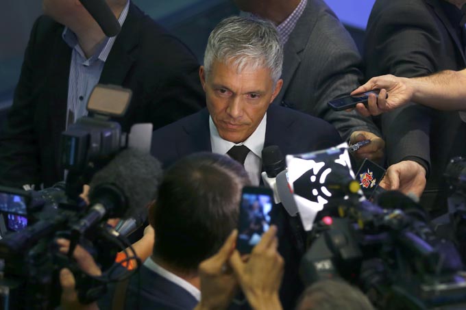 Swiss Attorney General Michael Lauber (C) speaks to media following a news conference in Bern, Switzerland June 17, 2015. Photo: Reuters