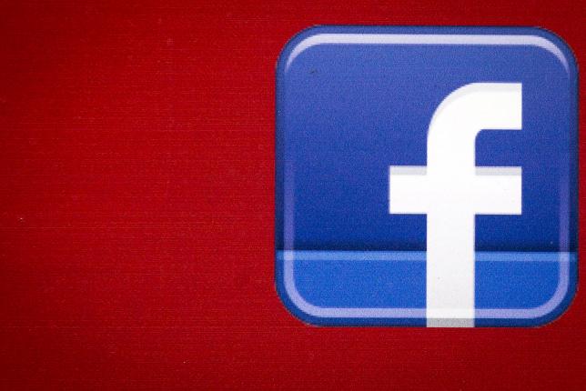 A Facebook logo is displayed on the side of a tour bus in New York's financial district July 28, 2015. REUTERS/Brendan McDermid