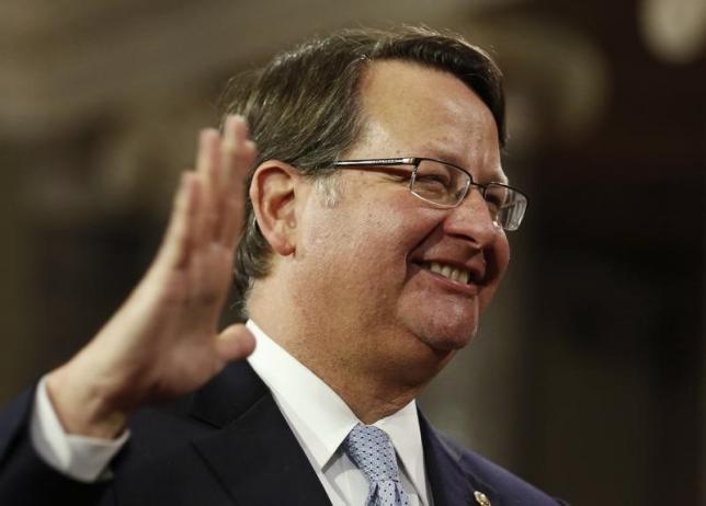US Senator Gary Peters (D-MI) smiles as he is ceremonially sworn-in by Vice President Joseph Biden in the Old Senate Chamber on Capitol Hill in Washington January 6, 2015. Photo: Reuters