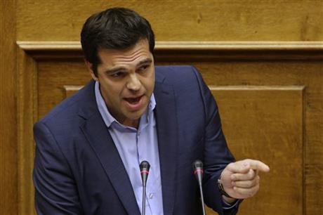 Greece's Prime Minister Alexis Tsipras delivers a speech during an emergency parliament session in Athens, Thursday, July 23, 2015. Greek lawmakers launched a late-night debate Wednesday on further reforms demanded by international creditors in return for a third multi-billion-euro bailout, with attention focusing on government dissenters who have vowed to reject the measures. AP