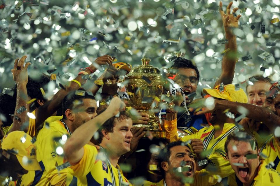 nChennai Super Kings players celebrate with the trophy after the IPL Twenty20 cricket final match against Royal Challengers Bangalore in Chennai on May 29, 2011. Photo: AFP