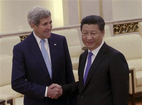 FILE - In this May 17, 2015 file-pool photo, Secretary of State John Kerry shakes hands with Chinese President Xi Jinping at the Great Hall of the People in Beijing, China. AP