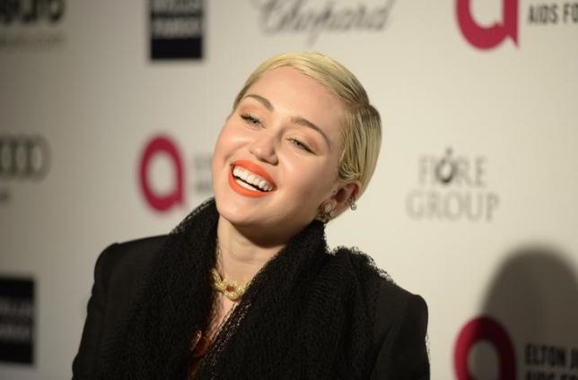 Singer Miley Cyrus arrives at the 2015 Elton John AIDS Foundation Oscar Party in West Hollywood, California February  22, 2015. REUTERS/Gus Ruelas