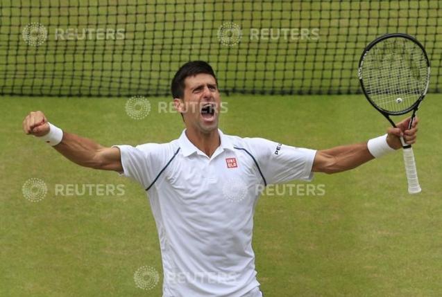 Novak Djokovic of Serbia celebrates after winning his Men's Singles Final match against Roger Federer of Switzerland at the Wimbledon Tennis Championships in London, July 12, 2015.                                                      REUTERS/Jonathan Brady/Pool