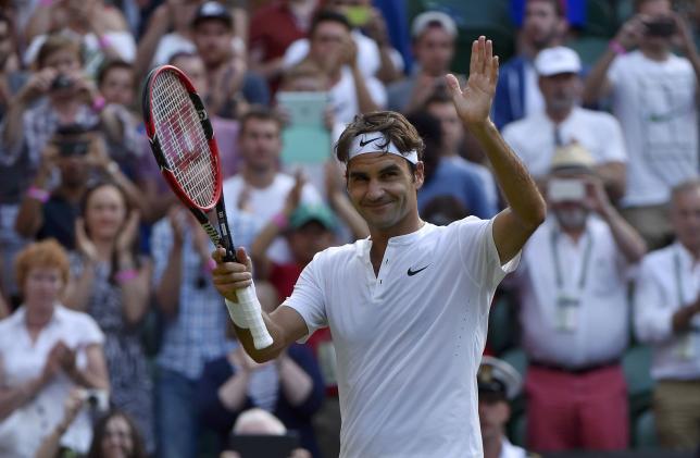 Roger Federer of Switzerland celebrates after winning his match against Roberto Bautista Agut of Spain at the Wimbledon Tennis Championships in London, July 6, 2015.  REUTERS/Toby Melville