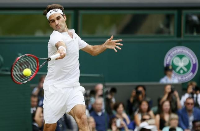 Roger Federer of Switzerland hits a shot during his Men's Singles Final match against Novak Djokovic of Serbia at the Wimbledon Tennis Championships in London, July 12, 2015.  REUTERS/Stefan Wermuth
