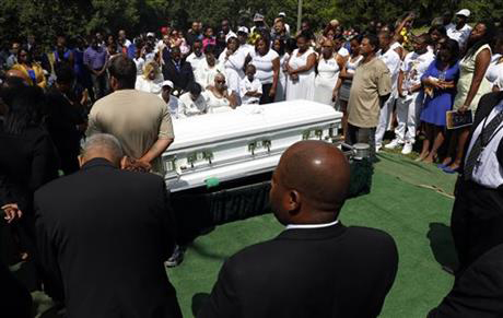 Mourners mourn the death of Sandra Bland at the Mt. Glenwood Memorial Gardens West cemetery Saturday, July 25, 2015, in Willow Springs, Ill. Hundreds of people attended Sandra Bland's funeral near the Chicago suburb where she grew up. They celebrated her life with words and songs of praise, and her mother danced in the church aisle with her arms raised.nPhoto:AP