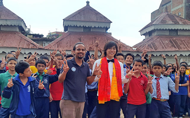 Japanese actor Shun Shioya of childrenu0092s series Power Ranger Ninja Storm posing for a photograph with students of Samata School, in nKathmandu, on Wednesday. Photo Courtesy: Sushil Adhikari