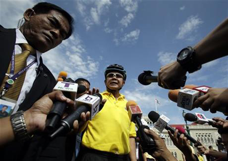 Thailand's Prime Minister Prayuth Chan-ocha, center, talks to reporters at government house in Bangkok, Thailand, Tuesday, July 28, 2015. Thai authorities are upset about being blacklisted by the U.S. for the second year in a row for failing to do enough to combat modern-day slavery. Prayuth said that Thailand was working on solving the issues and that the assessment was made when his administration, which took over after a military coup last year, was beginning to address the problems. Photo:AP
