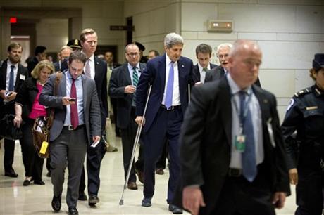 Secretary of State John Kerry, center, leaves a classified briefing for all House members on Capitol Hill, in Washington, Wednesday, July 22, 2015, to head to a Senate briefing to speak about the deal reached to curb Iran's nuclear program in exchange for billions of dollars in relief from international sanctions. AP