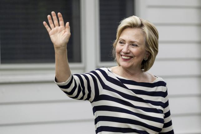 Democratic U.S. presidential candidate Hillary Clinton waves to supporters after she spoke at the home of Sean and Vidyha Bagniewski in the Beaverdale area of Des Moines, Iowa  July, 25, 2015. REUTERS/Brian C. Frank