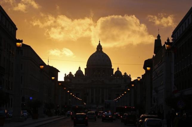 Saint Peter's Basilica at the Vatican is silhouetted during sunset in Rome, March 11, 2013. REUTERS/Paul Hanna/Files