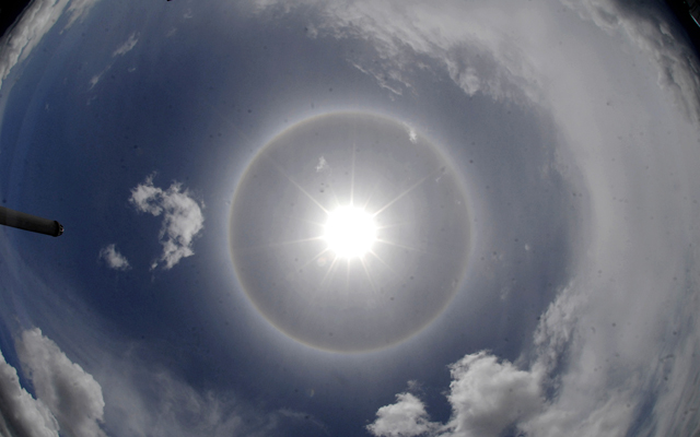 A halo (also known as a nimbus, icebow or gloriole) was seen around the Sun from Satdobato, Lalitpur, on Thursday. It is an optical phenomenon produced by light interacting with ice crystals suspended in the atmosphere. Photo: Naresh Shrestha / THT