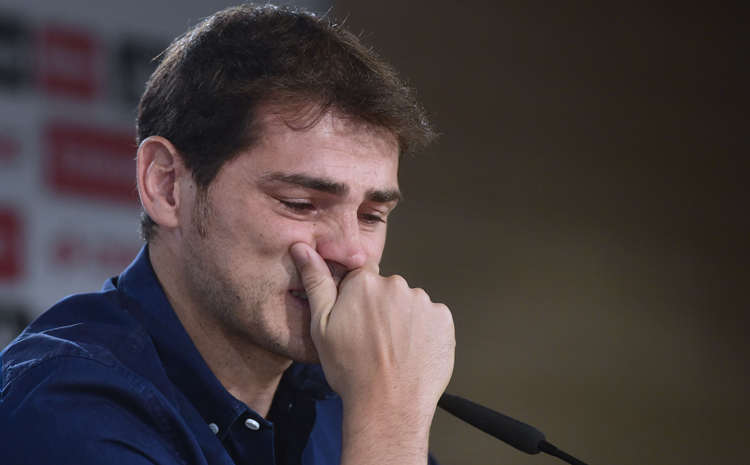 Real Madrid's goalkeeper Iker Casillas cries as he gives a press conference at the Santiago Bernabeu stadium in Madrid on July 12, 2015. Real Madrid's emblematic captain and goalkeeper Iker Casillas is set to leave the club for FC Porto after 25 years during which he won everything in the game with the Spanish giants. Photo: AFP