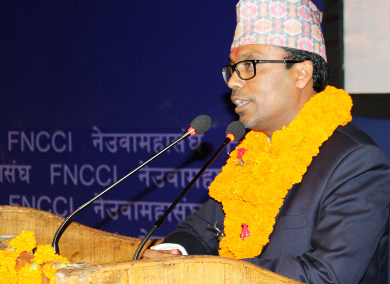 Unanimously elected as the new President of Federation of Nepalese Chambers of Commerce and Industry (FNCCI), Pashupati Murarka addresses the FNCCI special general convention in the Capital in July 2015. Photo: RSS 