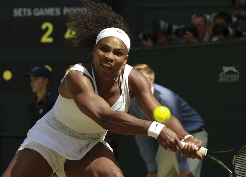 Serena Williams of the United States returns a shot to Garbine Muguruza of Spain during the women's singles final at the All England Lawn Tennis Championships in Wimbledon, London, Saturday July 11, 2015. Photo: AP