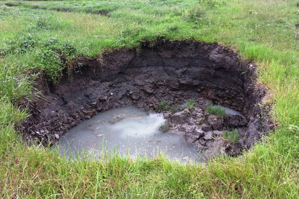 A sinkhole in Armala, Kaski, on Friday. With the onset of monsoon, more sinkholes are appearing.  Photo: THT
