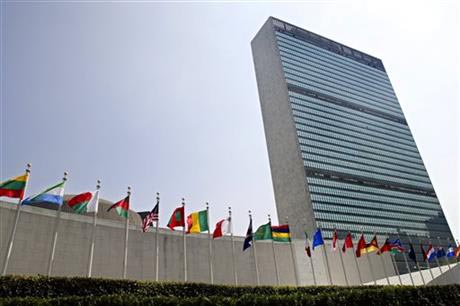 File - The flags of member nations fly outside the General Assembly building at the United Nations headquarters in New York, on September 13, 2005. Photo: AP