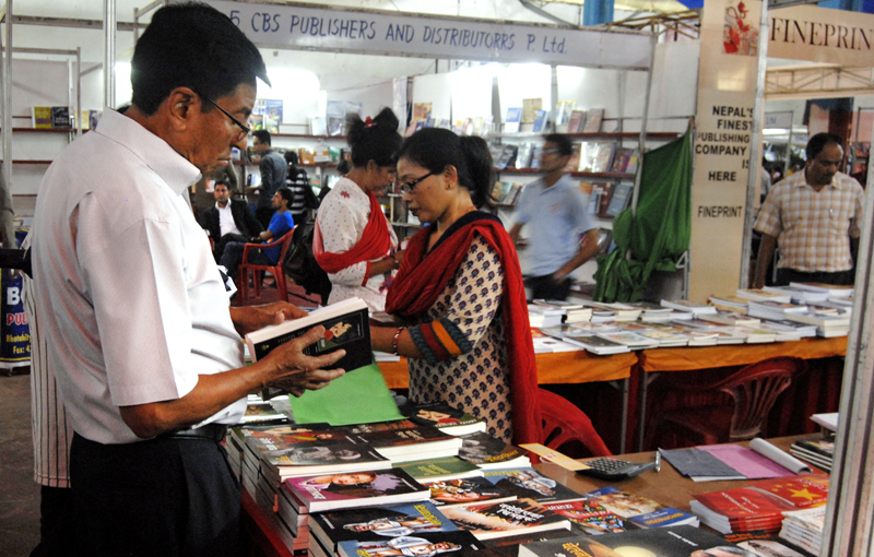 People browsing books during the 19th Nepal International Book Fair at Bhirkutimandap on Saturday. Photo: THT