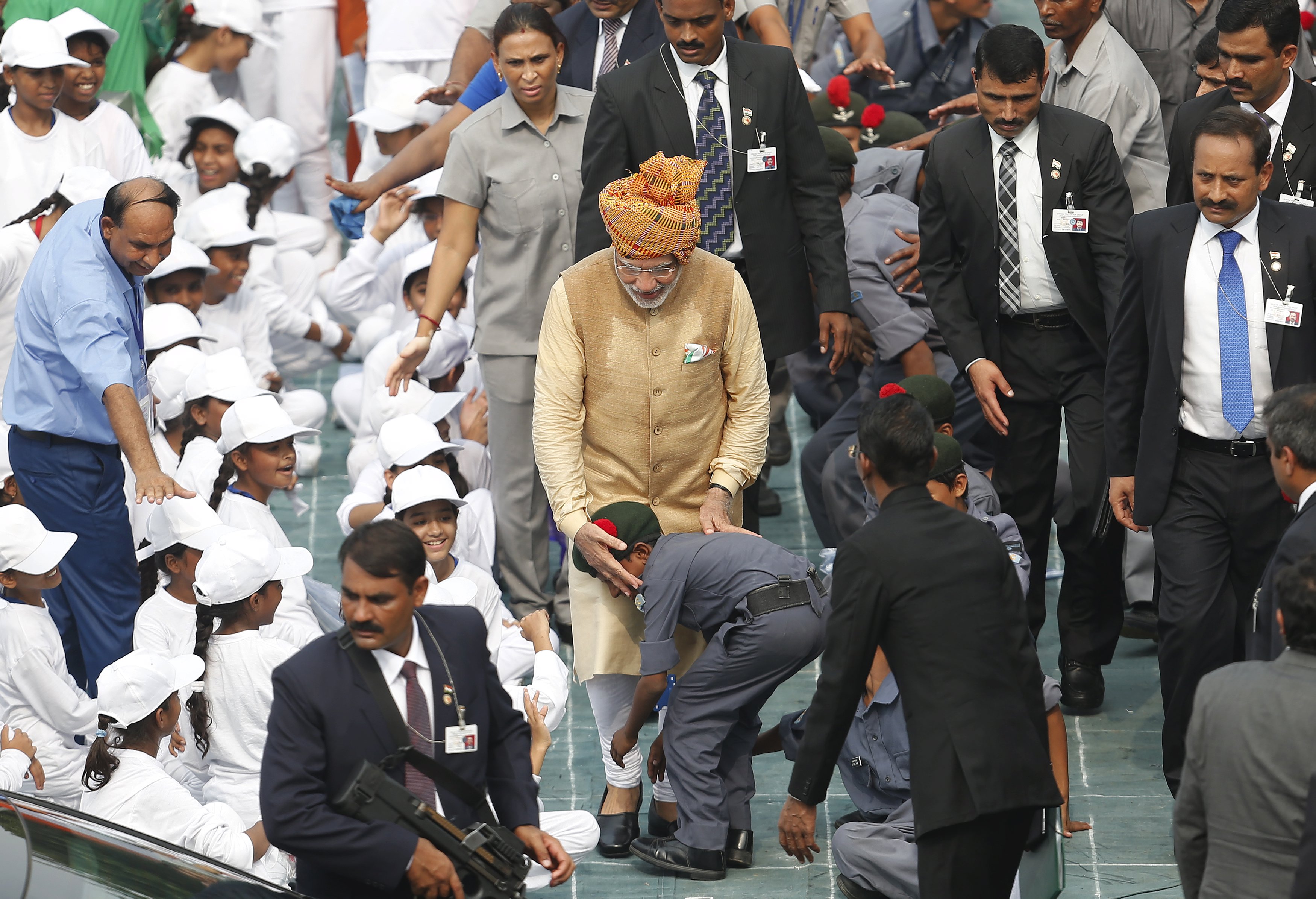 A school boy taking blessings from Indian Prime Minister Narendra Modi (centre) in front of the historic Red Fort during Independence Day celebrations in New Delhi, India on Saturday, August 15, 2015. Photo: Reuters