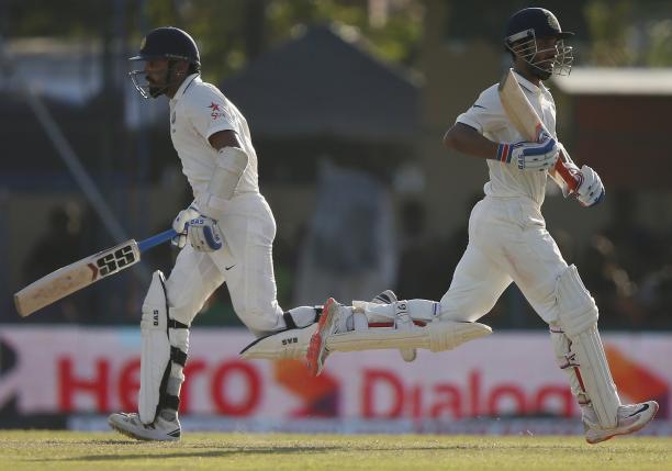 India's Ajinkya Rahane (R) and Murali Vijay run between wickets during the third day of their second test cricket match against Sri Lanka in Colombo August 22, 2015. REUTERS/Dinuka Liyanawatte