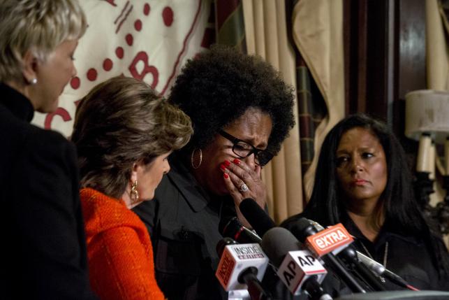 Attorney Gloria Allred (2nd L) comforts Charlotte Fox (2nd R), who is accusing comedian Bill Cosby of sexual misconduct, during a news conference in New York August 20, 2015. Also pictured are accusers, a woman they called 'Elizabeth' (L) and Sarita Butterfield (R).  REUTERS/Brendan McDermid