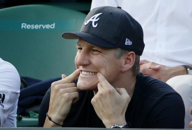 German footballer Bastian Schweinsteiger gestures during the match between Ana Ivanovic of Serbia and Bethanie Mattek-Sands of U.S.A. at the Wimbledon Tennis Championships in London, in this July 1, 2015 file photo. REUTERS/Stefan Wermuth/Files