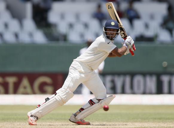 India's Cheteshwar Pujara plays a shot during the second day of their third and final test cricket match against Sri Lanka in Colombo , August 29, 2015. REUTERS/Dinuka Liyanawatte