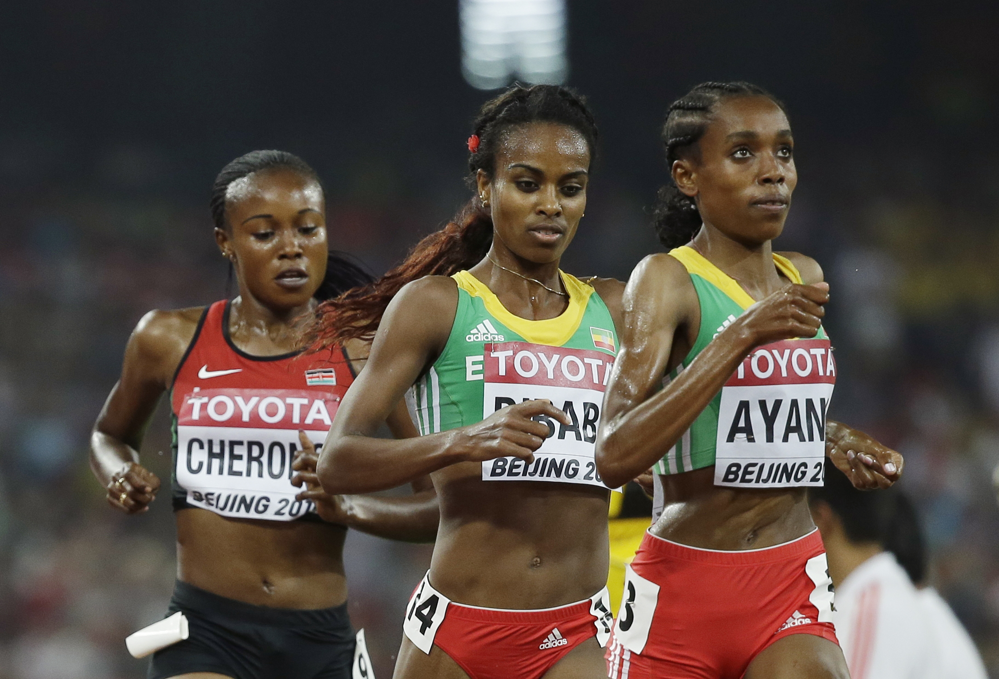 Ethiopia's Almaz Ayana, leads, Ethiopia's Genzebe Dibaba and Kenya's Mercy Cherono in the womenu0092s 5000m final at the World Athletics Championships at the Bird's Nest stadium in Beijing, Sunday, Aug. 30, 2015. Photo: AP