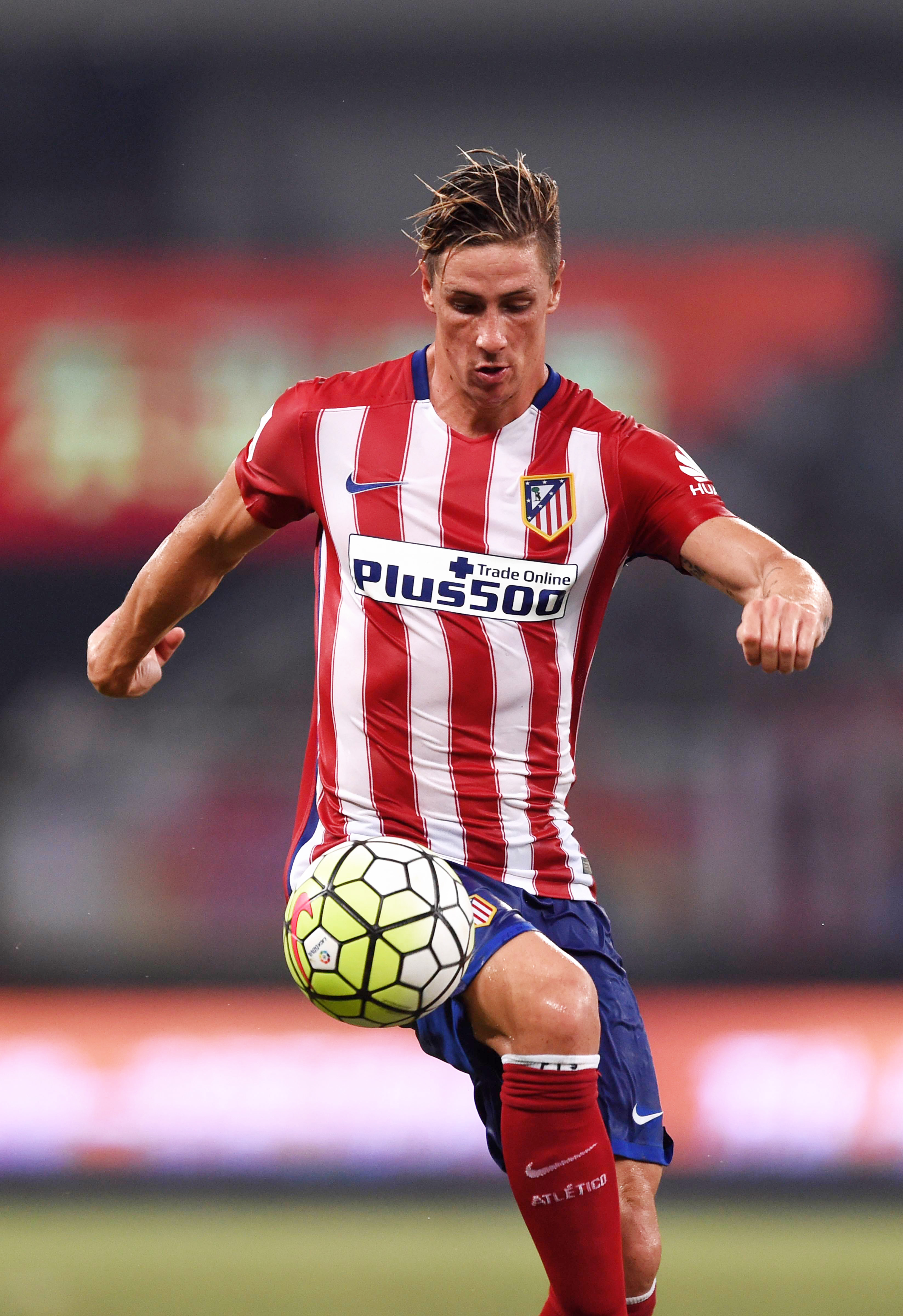 Atletico Madrid's Fernando Torres controls the ball during a friendly match against Shanghai SIPG on Tuesday. Photo: AFP