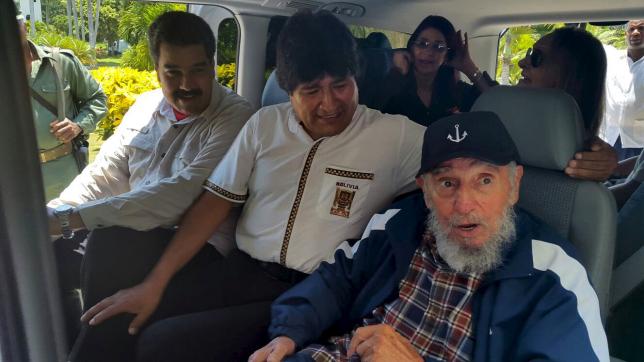 Cuba's former President Fidel Castro (R), Bolivia's President Evo Morales and Venezuela's President Nicolas Maduro sit together in a van in Havana, Cuba, August 13, 2015, in this handout courtesy of the Agencia Boliviana de Informacion (ABI). Fidel Castro is celebrating his 89th birthday on August 13. Cilia Flores (rear L), wife of Venezuela's President Nicolas Maduro and Dalia Soto del Valle (rear R, seated behind Castro), wife of Fidel Castro, are seated in the back of the van. REUTERS/Agencia Boliviana de Informacion/Handout via Reuters  ATTENTION EDITORS - THIS PICTURE WAS PROVIDED BY A THIRD PARTY. REUTERS IS UNABLE TO INDEPENDENTLY VERIFY THE AUTHENTICITY, CONTENT, LOCATION OR DATE OF THIS IMAGE. FOR EDITORIAL USE ONLY. NOT FOR SALE FOR MARKETING OR ADVERTISING CAMPAIGNS. THIS PICTURE WAS PROCESSED BY REUTERS TO ENHANCE QUALITY. AN UNPROCESSED VERSION WILL BE PROVIDED SEPARATELY.      TPX IMAGES OF THE DAY