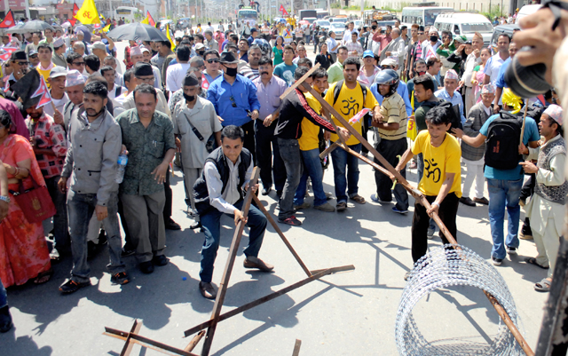 Hindu activists resorting to vandalism demanding that Nepal be declared a Hindu state, in New Baneshwor, Kathmandu, on Monday. Photo: THT