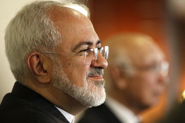 Iranian Foreign Minister Mohammad Javad Zarif (L) listens to a question at a news conference with Pakistan's national security adviser Sartaj Aziz at the foreign ministry in Islamabad, Pakistan, August 13, 2015.  REUTERS/Caren Firouz/Files