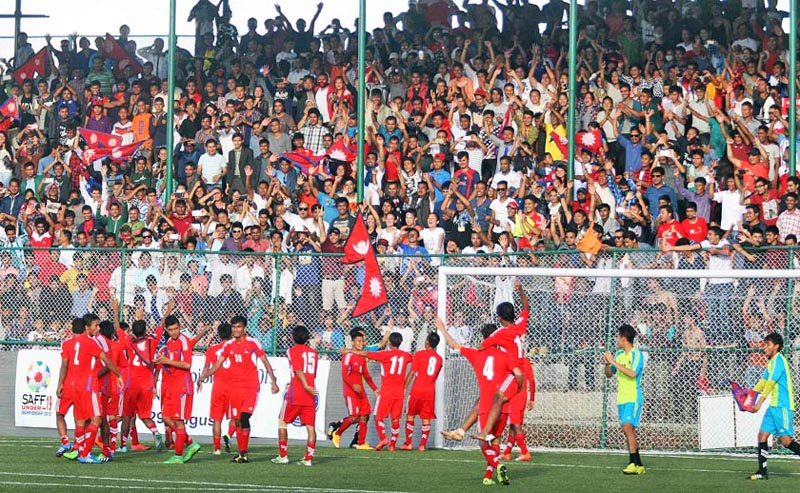 The Nepal Under-19 football players acknowledge the crowd  as they celebrate their victory over India in the final of the first SAFF U-19 Championship at the ANFA Complex grounds in Lalitpur on Saturday. Nepal defeated nIndia 5-4 in penalty shoot-out to win the first major title in more than two decades.nPhoto: Udipt Singh Chhetry /THT