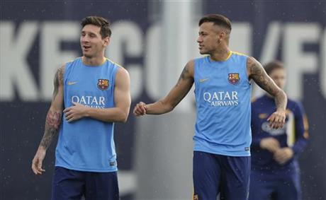 FC Barcelona's Lionel Messi, from Argentina, left, and Neymar, from Brazil, attend a training session at the Sports Center FC Barcelona Joan Gamper in San Joan Despi, Spain, Saturday, Aug. 22, 2015. AP