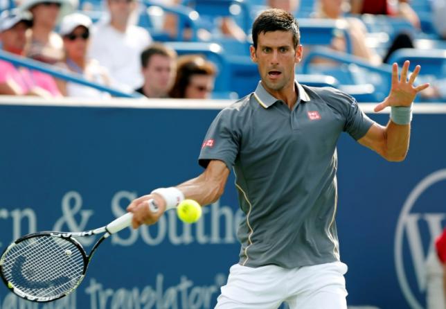 Novak Djokovic (SRB) returns a shot against Benoit Paire (not pictured) on day five during the Western and Southern Open tennis tournament at Linder Family Tennis Center. Mandatory Credit: Aaron Doster-USA TODAY Sports