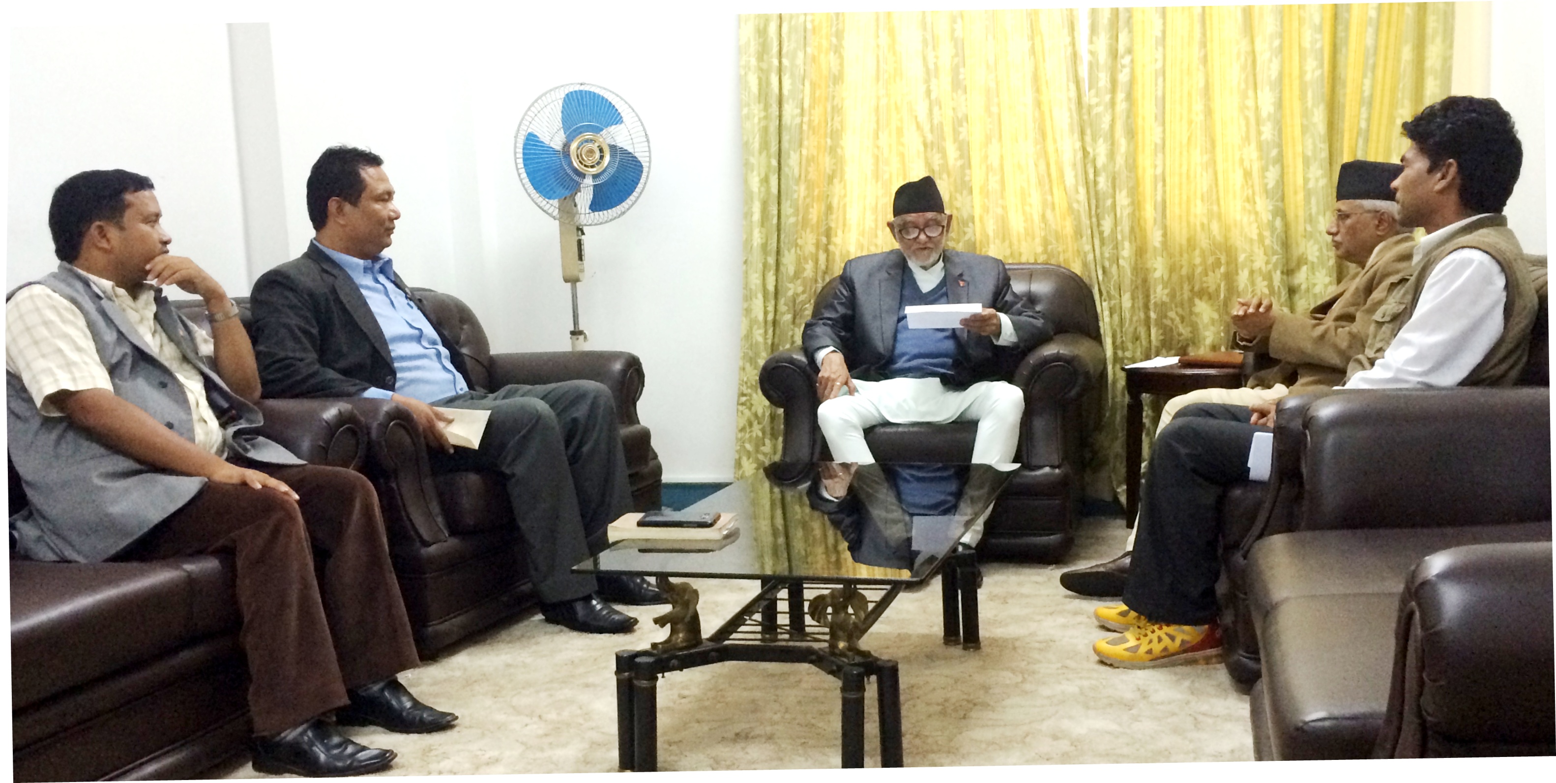 PM Sushil Koirala reads out a reply submitted by Tharu leaders, at his residence in Baluwatar, on Monday, August 31, 2015. Photo: PM's Secretariat