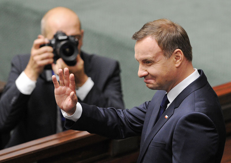Polandu2019s new, conservative President Andrzej Duda greets the National Assembly after he officially took office in a swearing-in ceremony at the Parliament in Warsaw, Poland, Thursday, Aug. 6, 2015. Photo: AP  