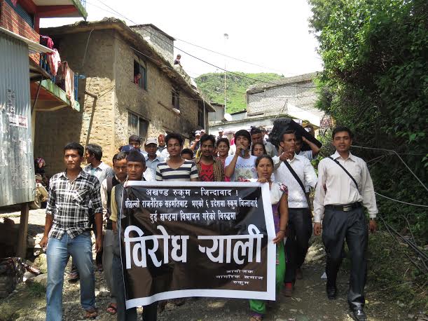 Participants taking part in a protest rally organised by the Civil Society against the parties decision to split the district into two states in Musikot on Sunday, August 09, 2015. Photo: Adarsh KC